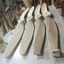 Culver props in shown in four stages of trimming and sanding.